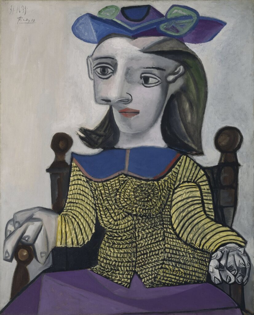 Cubist portrait of a seated woman wearing a patterned yellow sweater, painted by Picasso in 1939 — oil on canvas from the Heinz Berggruen Collection