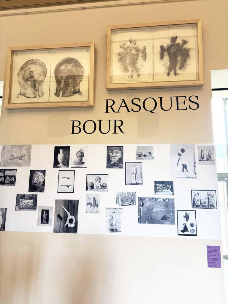 Black-and-white collage of archival images with two framed drawings of heads and figures above; partial wall typography. Exhibition Très chère Louise by Lise Terdjman, Musée de Picardie (26 Aug 2025 – 4 Jan 2026).