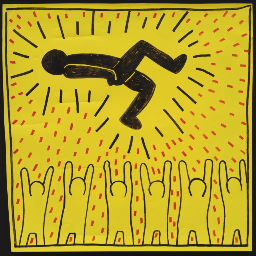 Œuvre sur fond jaune vif représentant une figure noire stylisée projetée en l’air et entourée de silhouettes levant les bras, dans le style iconique de Keith Haring. Présentée par Martos Gallery à BRAFA 2026, l’image met en avant les traits graphiques noirs, les lignes d’énergie et la dimension pop et engagée de l’artiste.