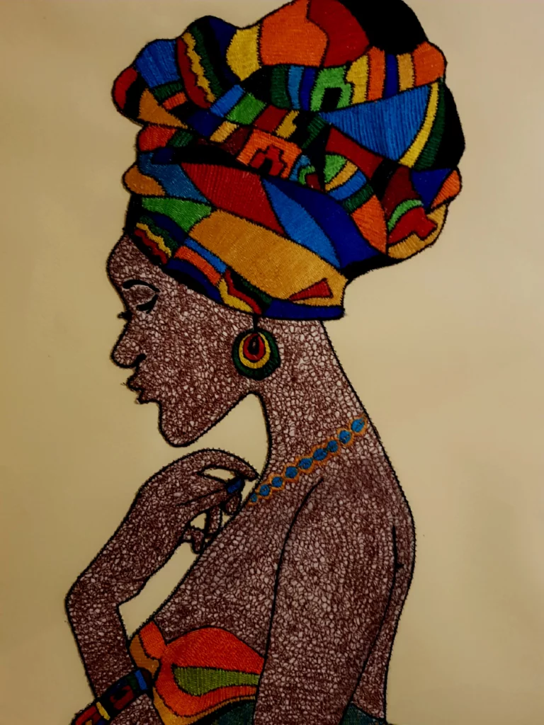 Portrait textile d’une femme africaine de profil, broderie artistique de Willfreed avec turban multicolore et détails graphiques en fil.