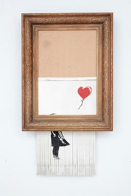 Love Is in the Bin de Banksy après son autodestruction lors d'une vente Sotheby's, devenue l'une des œuvres les plus marquantes du marché de l'art contemporain.