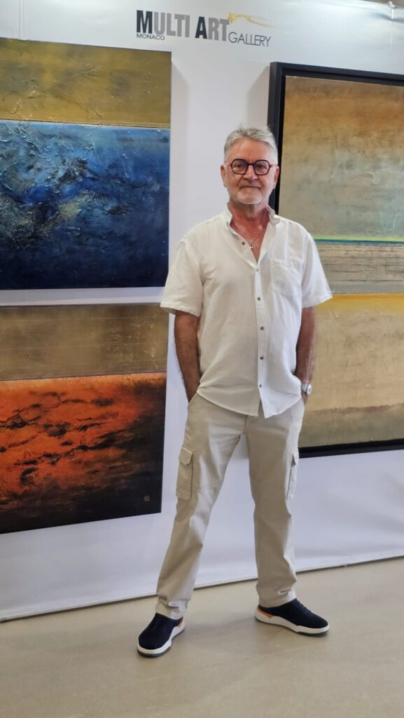 Jean Claude Bertrand with his painting at Art Riviera Tour 2026